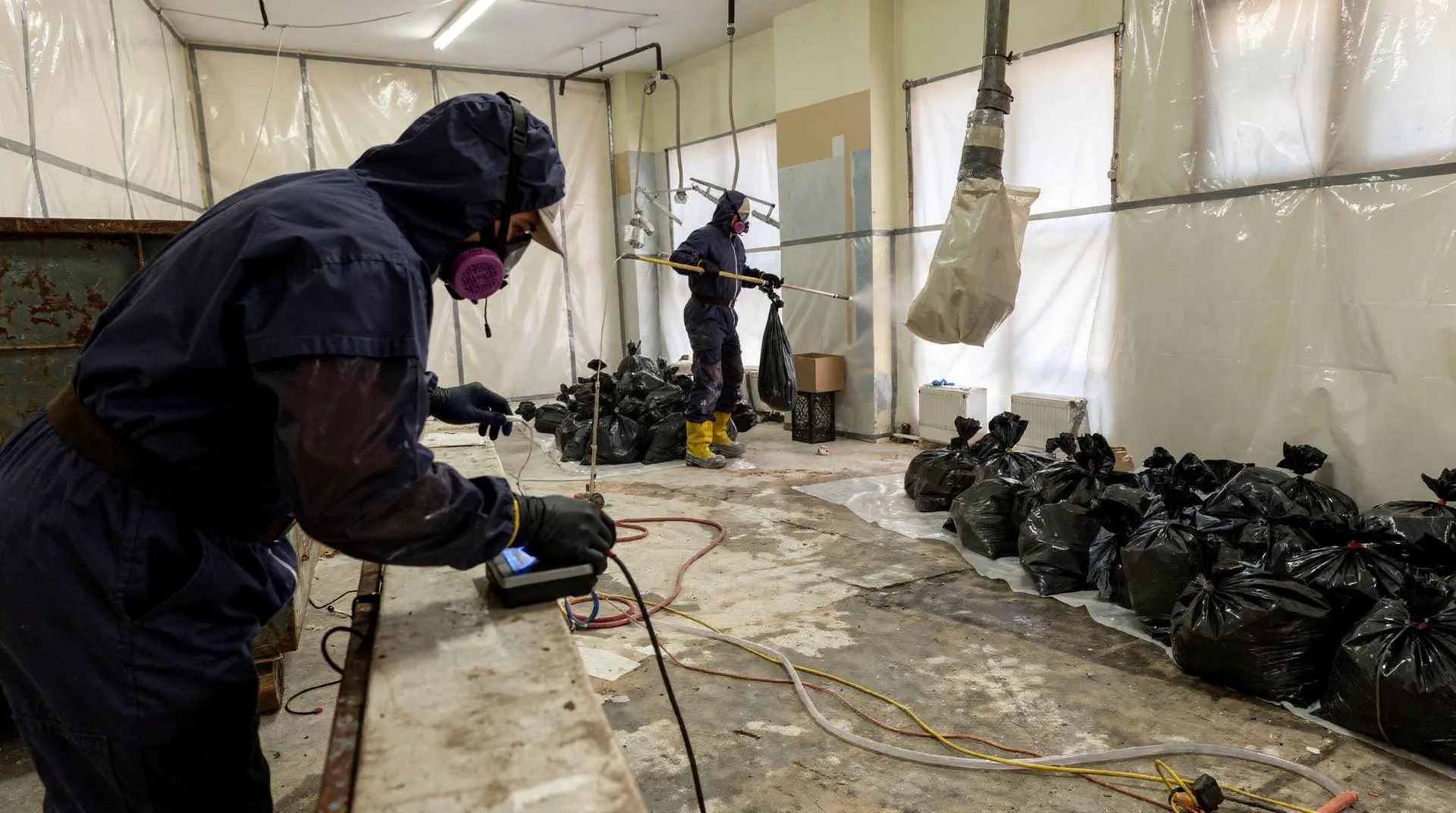 Professional asbestos removal begins with comprehensive testing to identify asbestos-containing materials before abatement